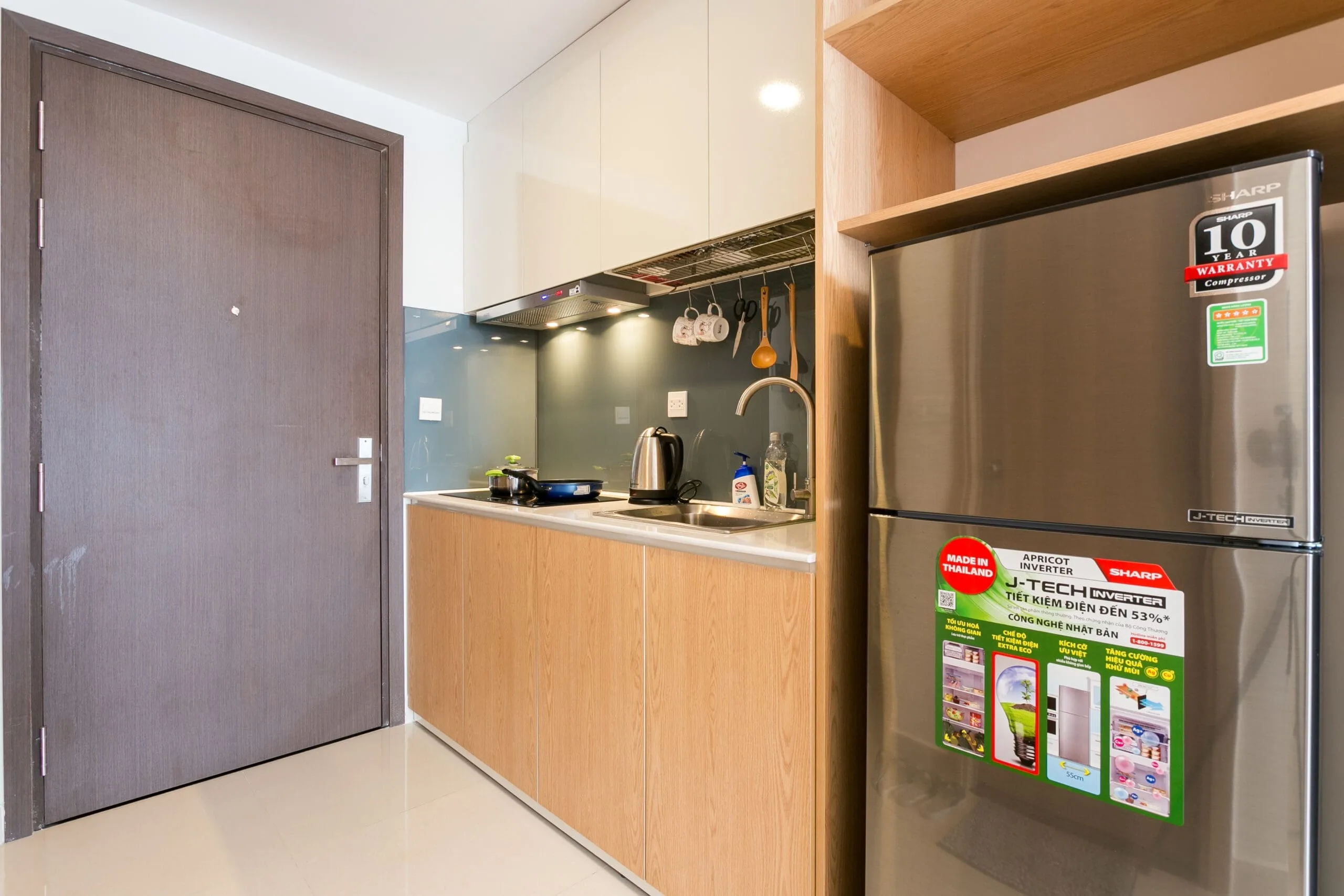 Private kitchen area in Studio Apartment at RiverGate Residence