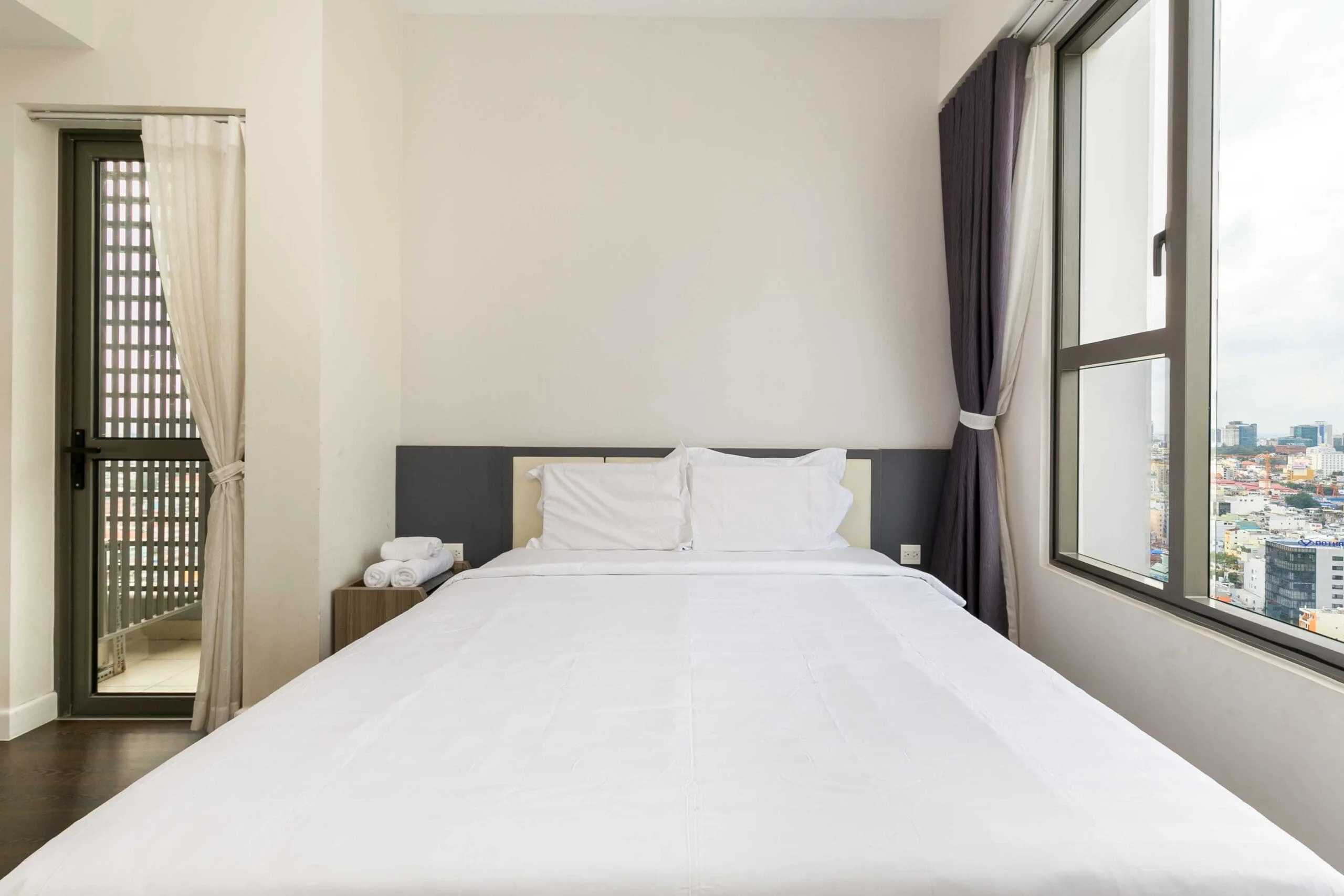 Comfortable bedroom in Three-Bedroom Apartment at RiverGate Residence