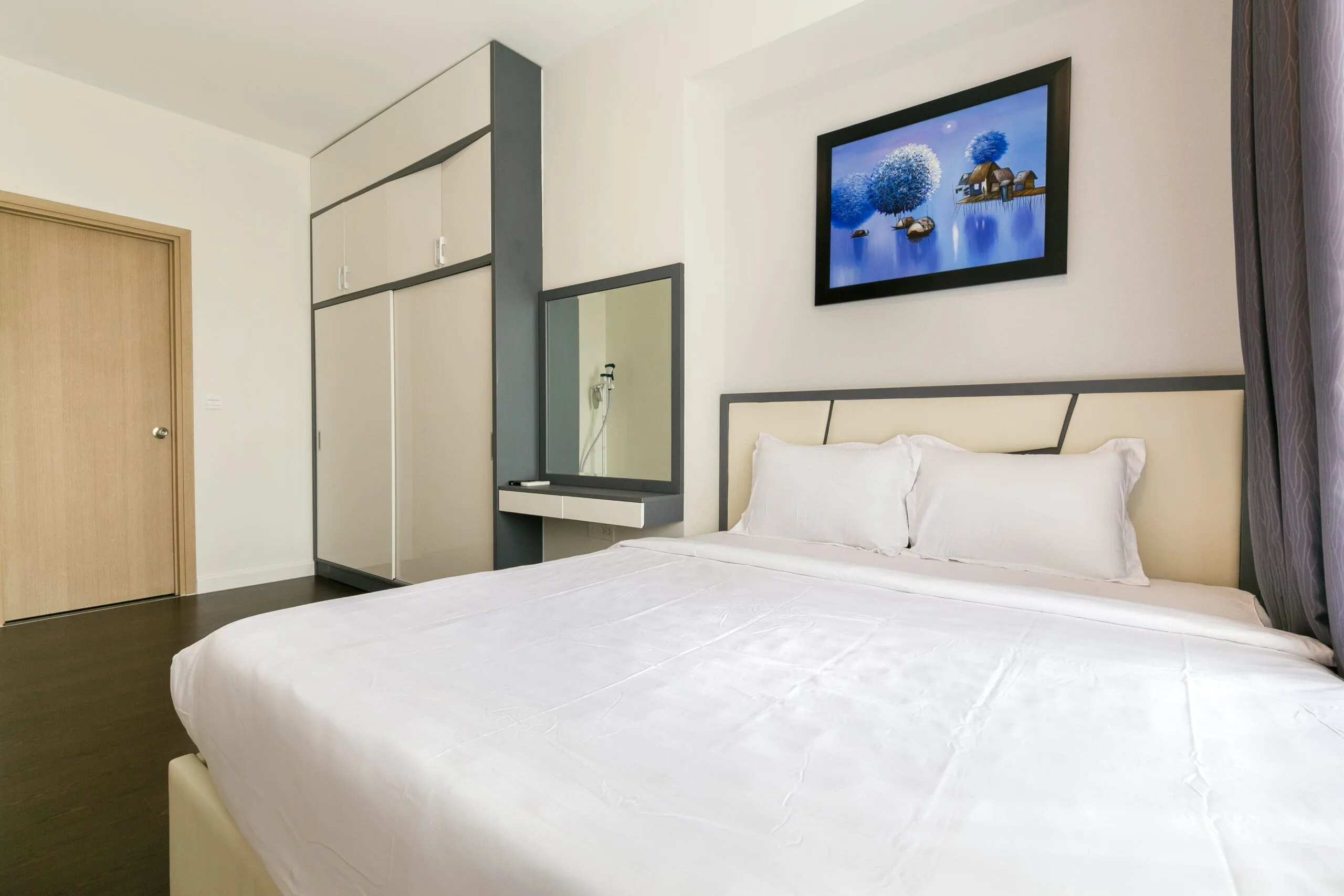 Bedroom with city view in Three-Bedroom Apartment at RiverGate Residence