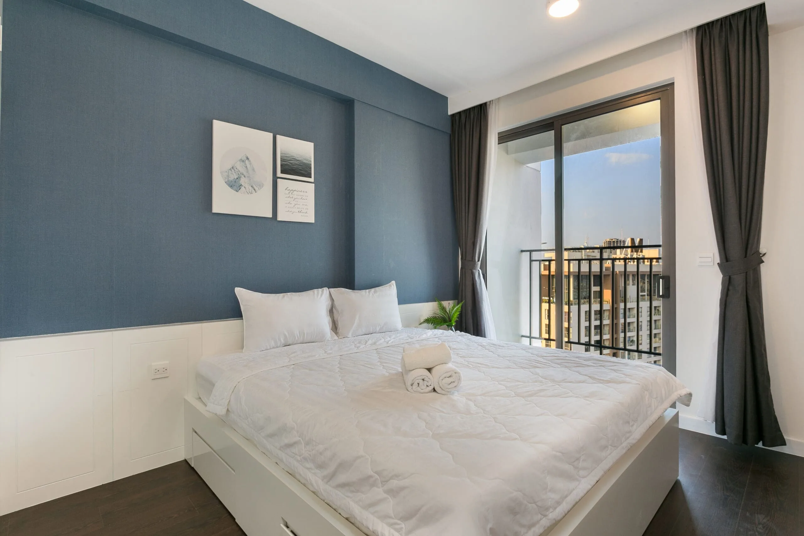 Second bedroom with balcony in Two-Bedroom Apartment at RiverGate Residence