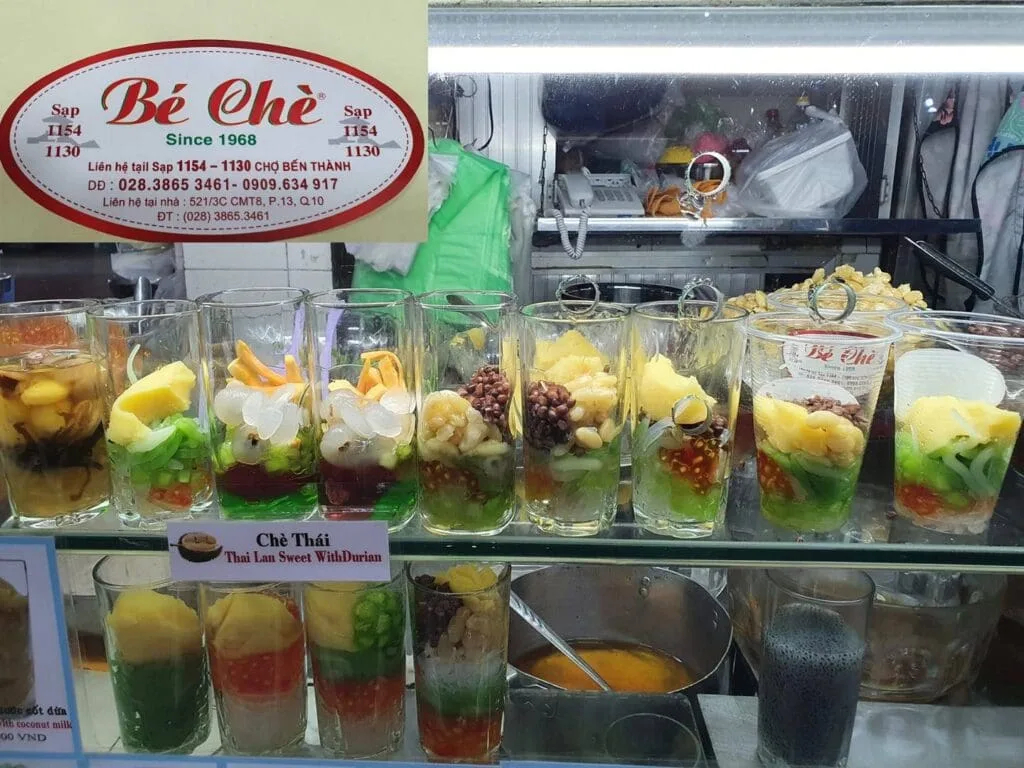 Traditional Vietnamese sweet dessert (Chè) served in colorful varieties at Ben Thanh Market in Ho Chi Minh City.
