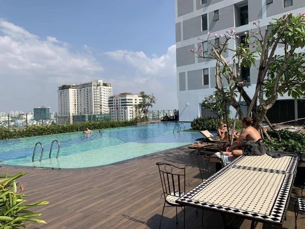 Guests Enjoying Outdoor Pool at RiverGate Residence