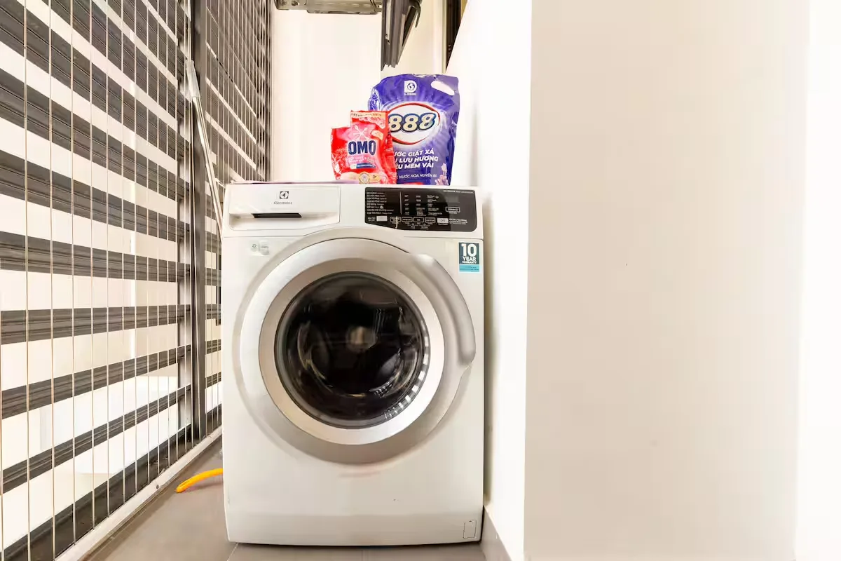 Washing machine in Studio Apartment at RiverGate Residence